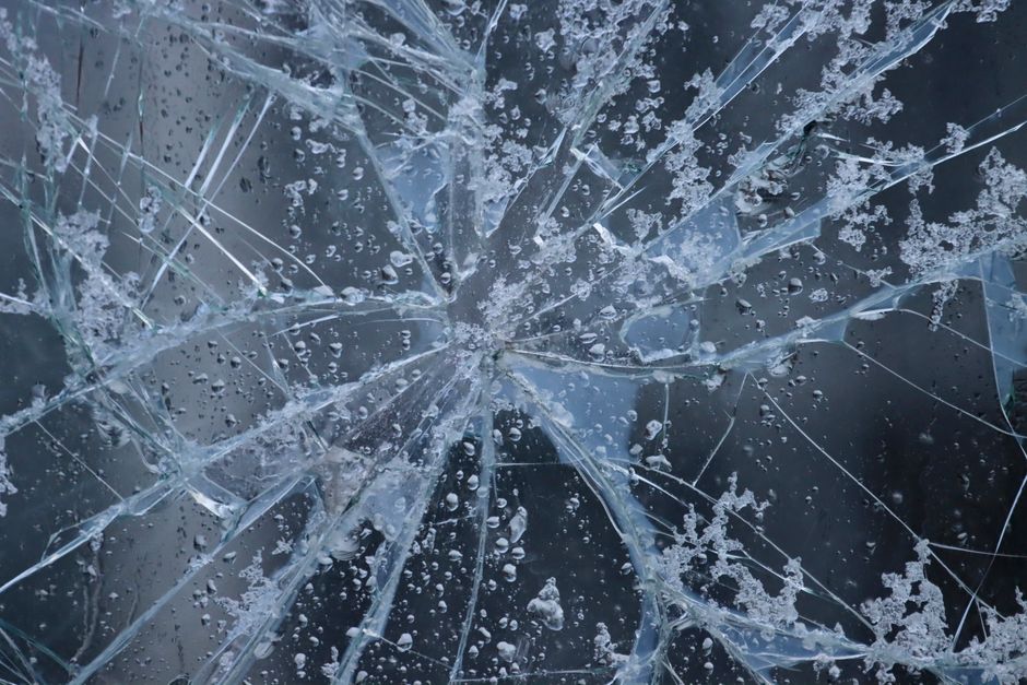 Close up of a cracked car windshield