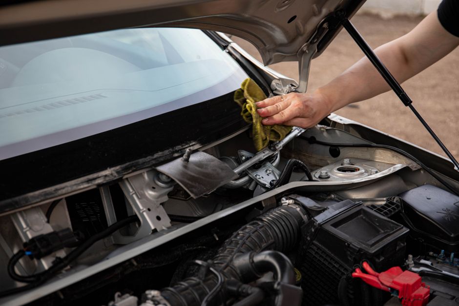 Professional replacing auto glass on a vehicle